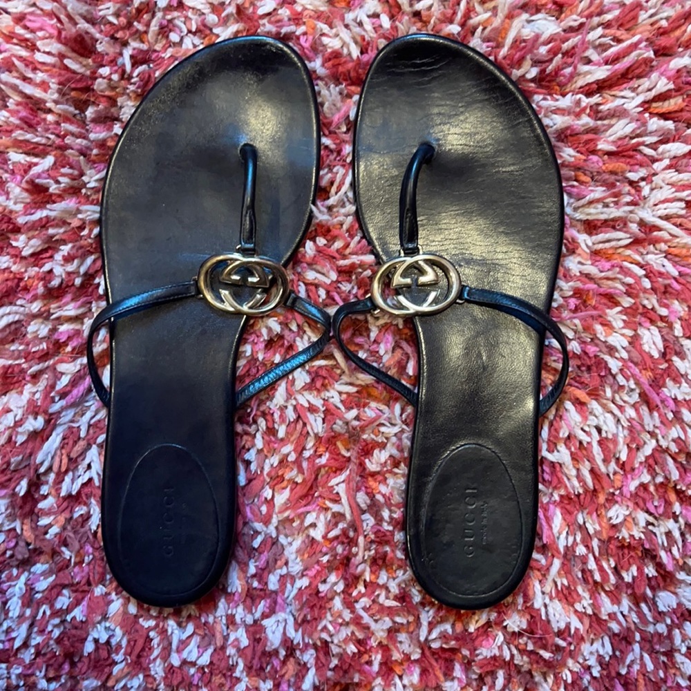 Black Gucci flip flops